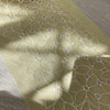 Pizzo tulle giallo con ricami bianchi