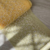 Pizzo tulle giallo con ricami bianchi