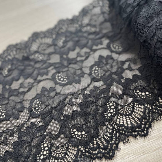 Pizzo elastico nero floreale con frange