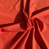 Tessuto tecnico a costine arancione, tessuto bielastico per lingerie, abbigliamento sportivo e costumi da bagno a taglio libero